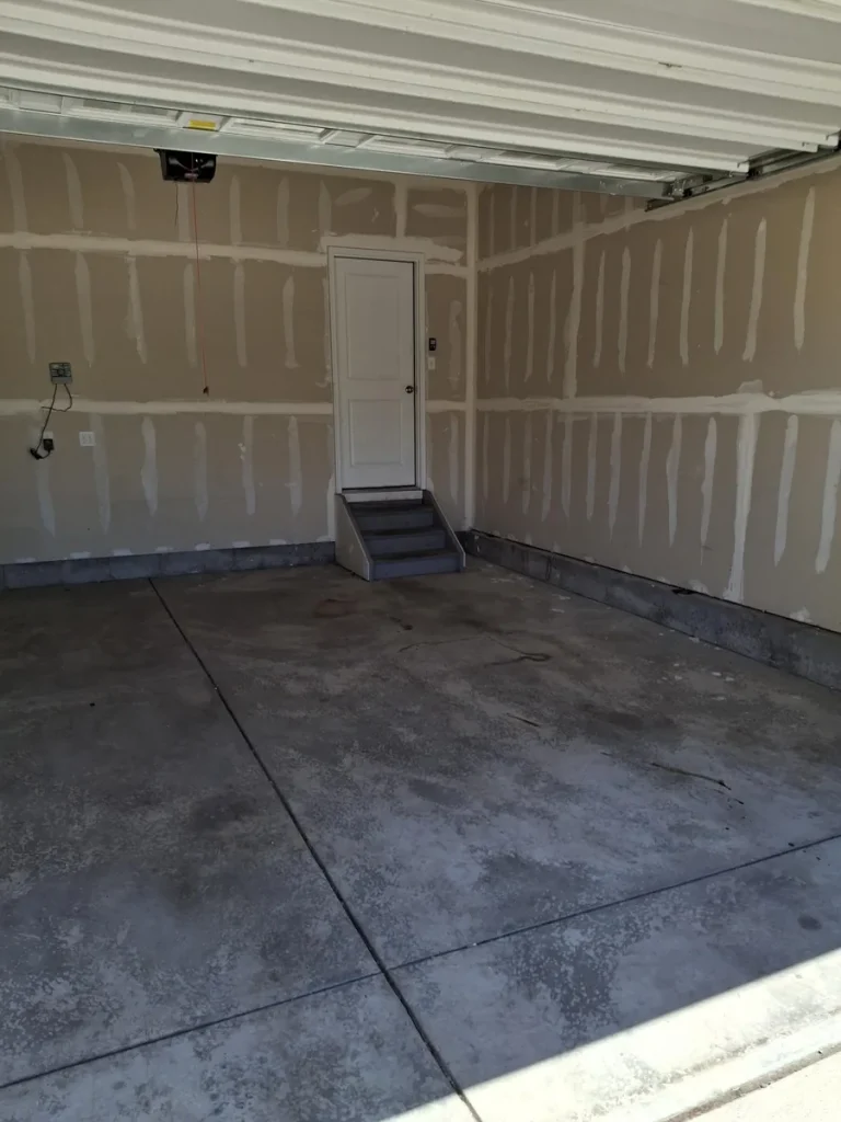 Empty garage after property cleanout in Colorado Springs