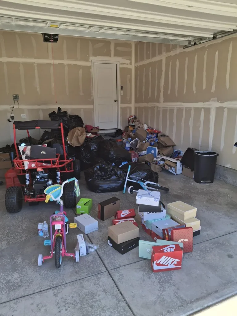 Garage filled with household items during a property cleanout in Colorado Springs