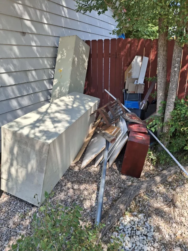 Outdoor junk and furniture before property cleanout in Colorado Springs