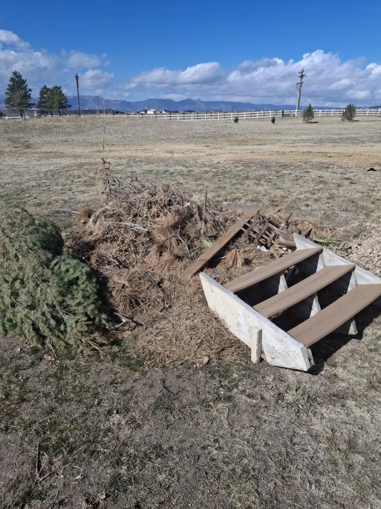 Large pile of branches and yard debris for removal in Colorado Springs